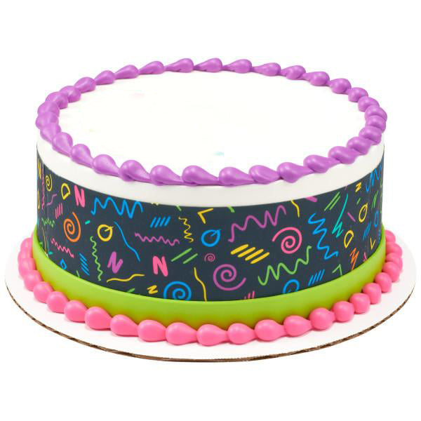 Retro 90s themed birthday cake with neon geometric patterns on a black wrap, purple top border, and pink base border. Retro 90s themed birthday cake with neon geometric patterns on a black wrap, purple top border, and pink base border.