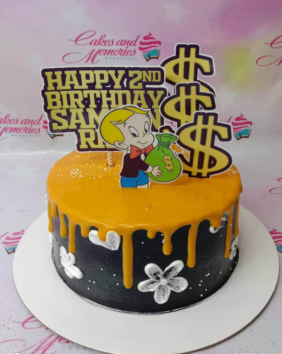 Black 1-tier Richie Rich themed birthday cake with yellow drip, white icing flowers, and money bag toppers. Black 1-tier Richie Rich themed birthday cake with yellow drip, white icing flowers, and money bag toppers.