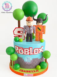 Blue Roblox themed cake with fondant character figures, brick wall design, and green trees Blue Roblox themed cake with fondant character figures, brick wall design, and green trees