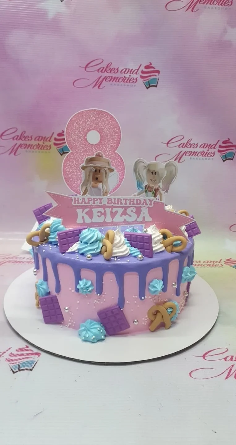 Pink Roblox themed birthday cake with purple drip, blue and white icing swirls, and character printouts for Keizsa's 8th birthday. Pink Roblox themed birthday cake with purple drip, blue and white icing swirls, and character printouts for Keizsa's 8th birthday.