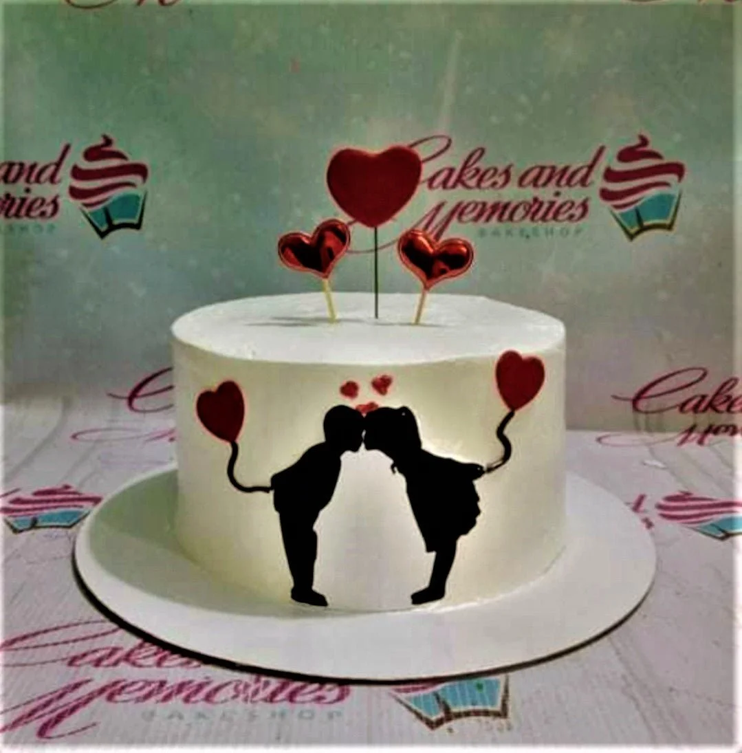 Romantic Silhouette White Heart Cake A white 1 Tier cake, Romantic Silhouette themed, with a black kissing couple silhouette and red heart accents.