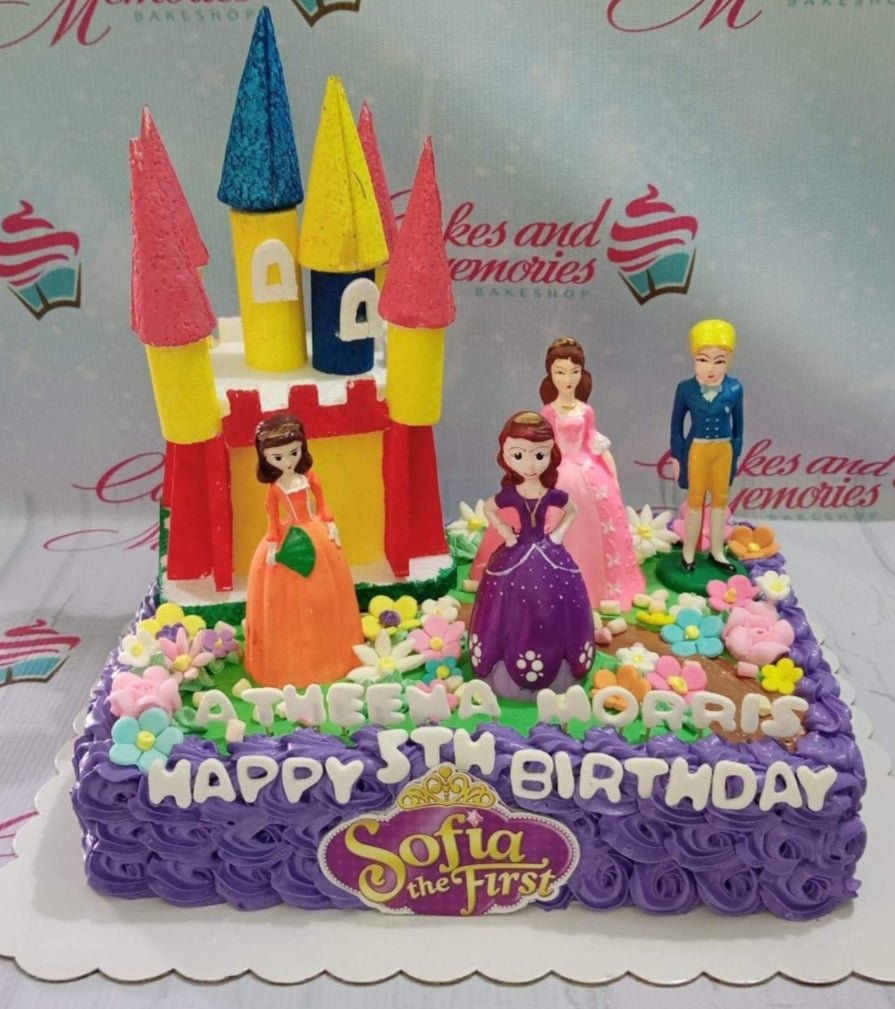 Purple square Sofia the First cake with a colorful castle topper, princess figurines, and edible flowers. Purple square Sofia the First cake with a colorful castle topper, princess figurines, and edible flowers.