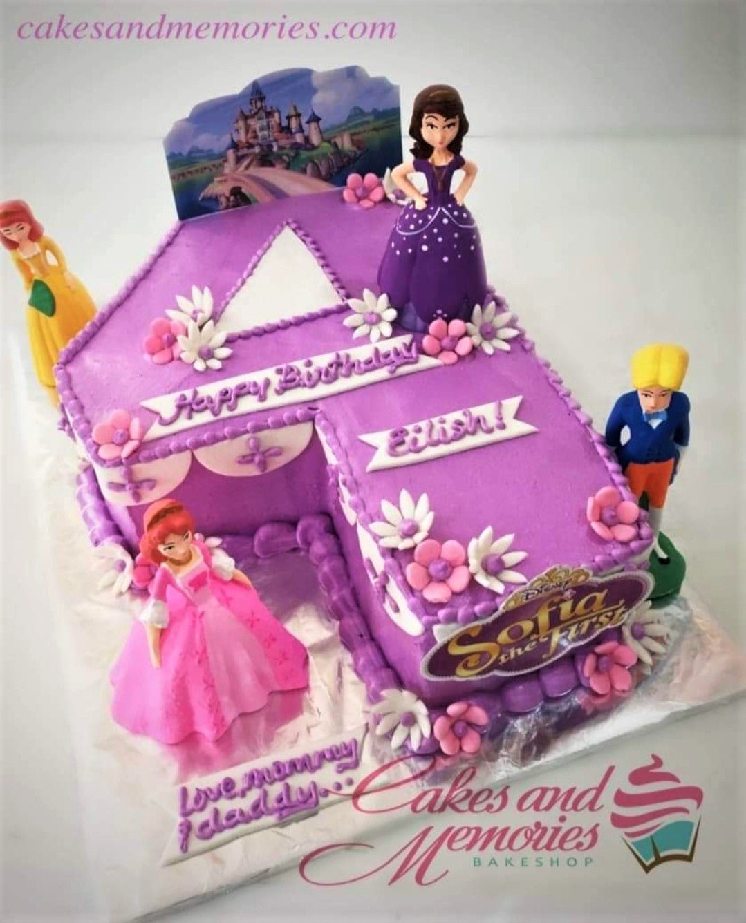 Purple number 4 shaped Sofia the First birthday cake with character figurines and pink and white fondant flowers. Purple number 4 shaped Sofia the First birthday cake with character figurines and pink and white fondant flowers.