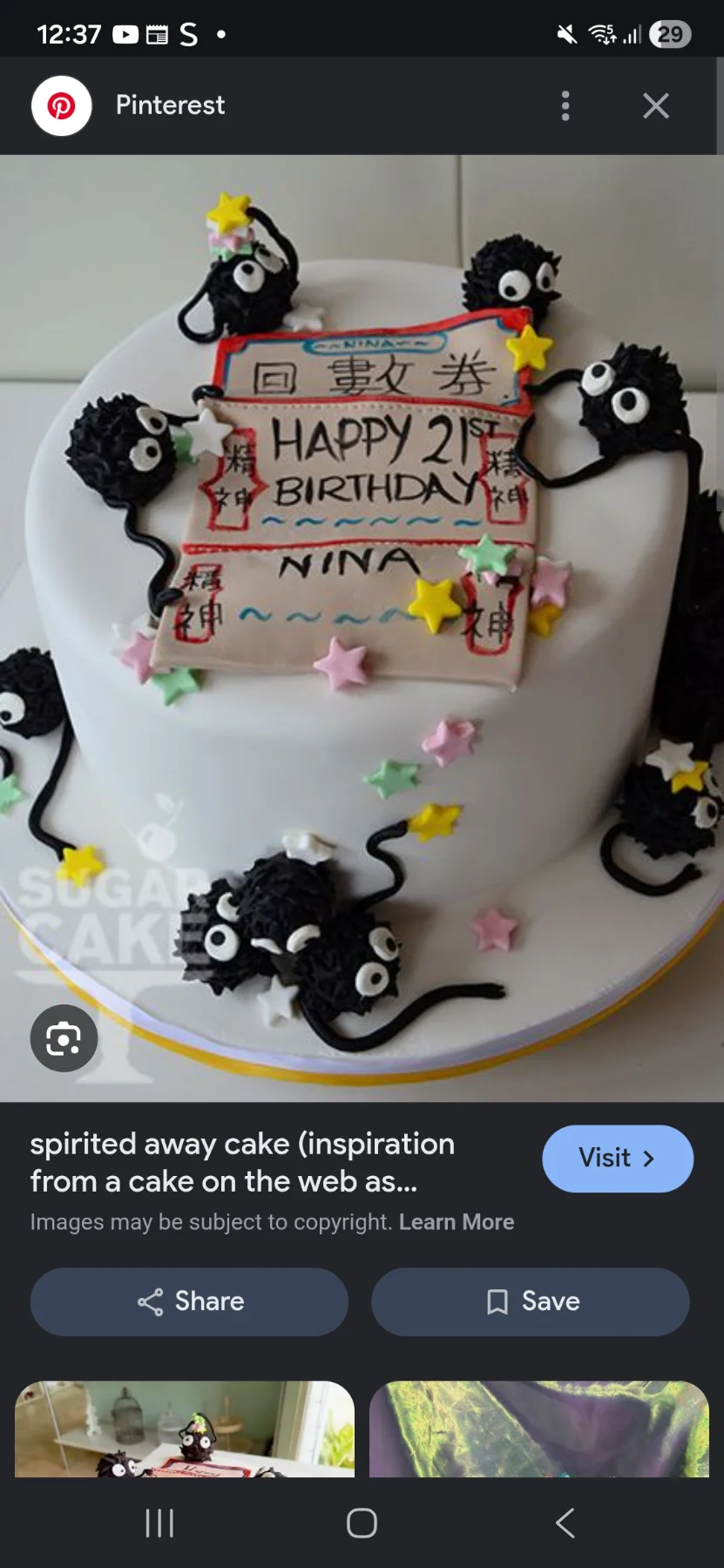 White fondant cake decorated with black edible soot sprites and a Japanese bath token topper for a 21st birthday. White fondant cake decorated with black edible soot sprites and a Japanese bath token topper for a 21st birthday.