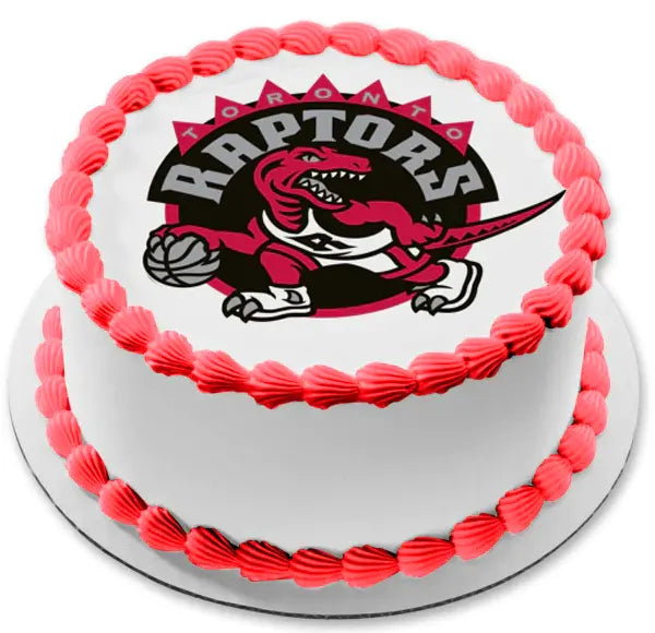 White round cake with red icing shell borders and a large Toronto Raptors logo printout on top. White round cake with red icing shell borders and a large Toronto Raptors logo printout on top.