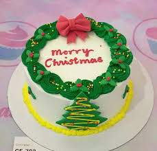 Traditional Christmas 1 Tier - white, red, green theme with red bow and yellow and orange sprinkles Traditional Christmas 1 Tier - white, red, green theme with red bow and yellow and orange sprinkles