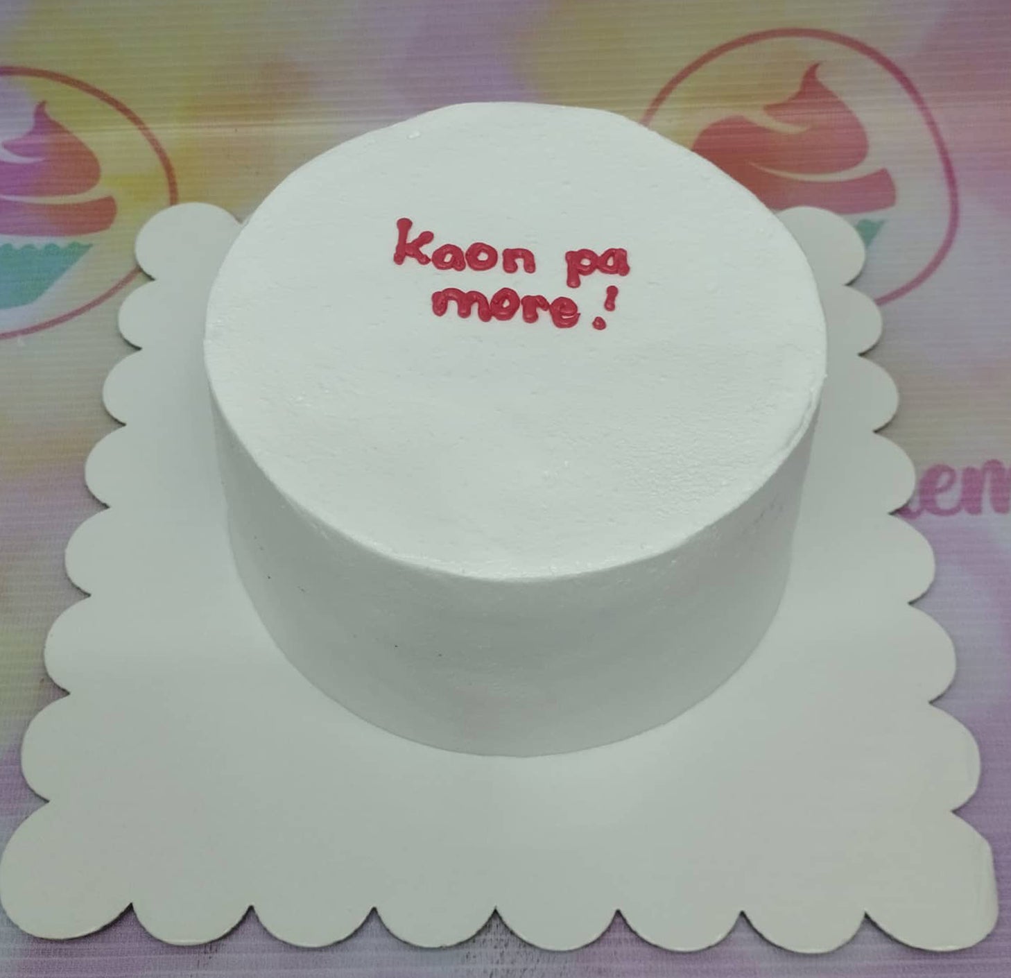 Minimalist white bento cake with red piped icing message Kaon pa more on top. Minimalist white bento cake with red piped icing message Kaon pa more on top.