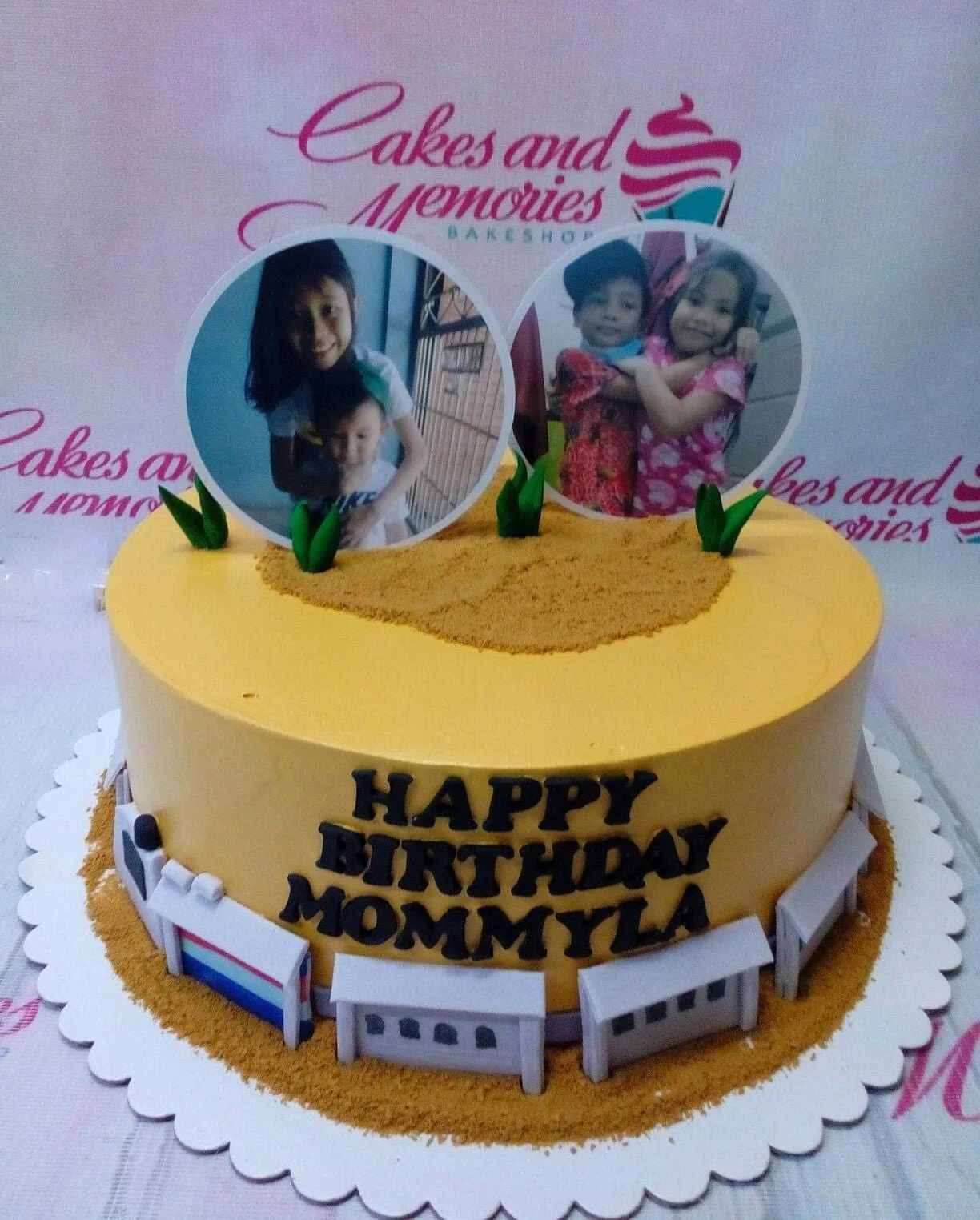 Yellow Photo Birthday Cake A yellow 1 Tier cake themed around photos, featuring children's photo toppers, green leaves, and school building panels.