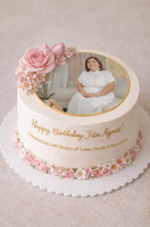 Elegant white soft-icing birthday cake for a 60th birthday featuring a photo print of a woman, pink gumpaste roses, and gold lettering. Elegant white soft-icing birthday cake for a 60th birthday featuring a photo print of a woman, pink gumpaste roses, and gold lettering.