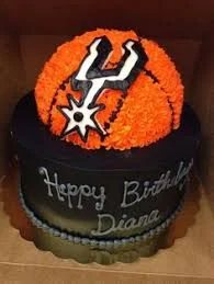 Basketball Spurs Black Birthday Cake Black single tier cake with orange basketball icing topper and San Antonio Spurs logo printout
