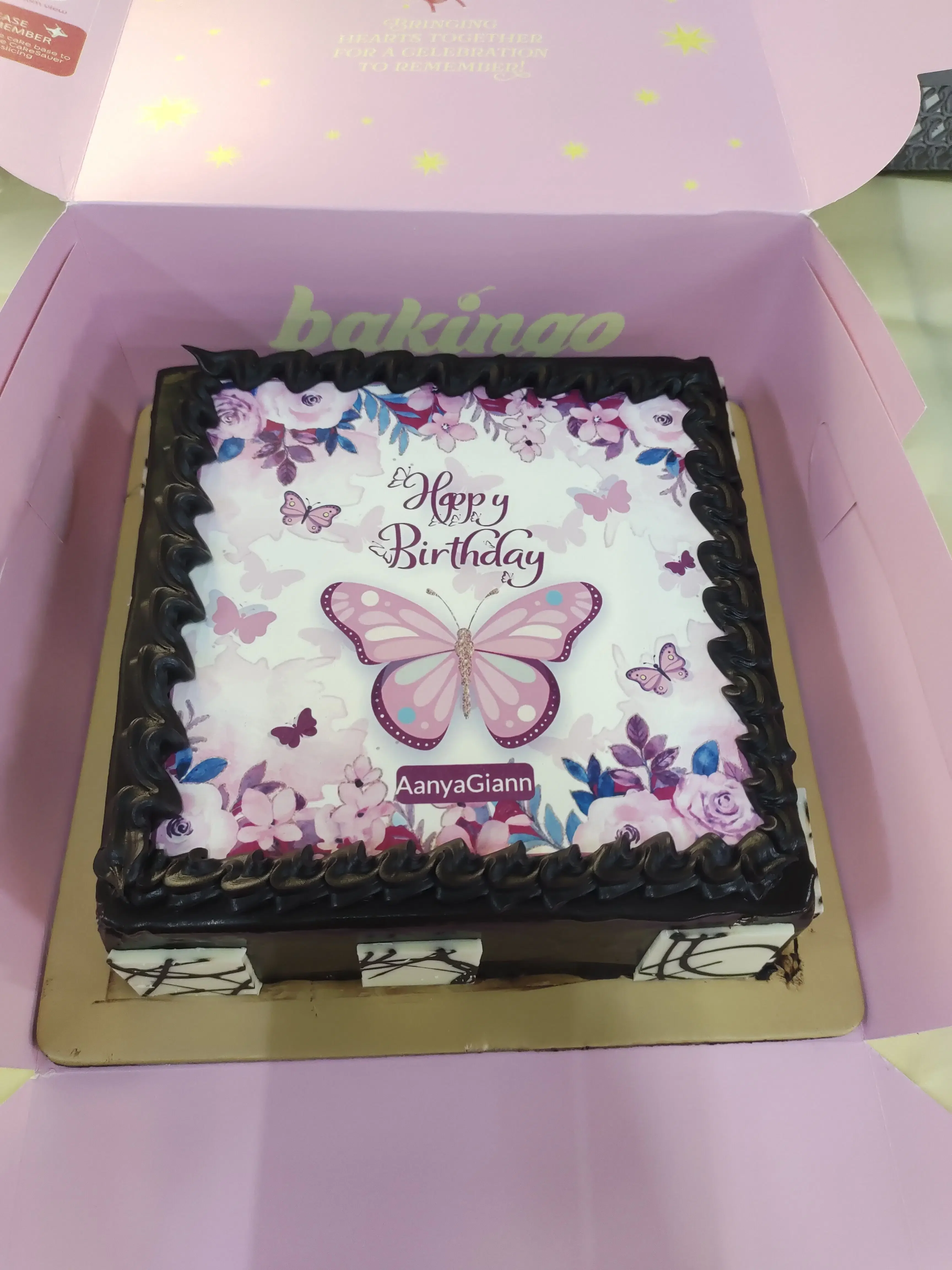 Square bento cake with edible photo print of butterfly and flowers and black piped border