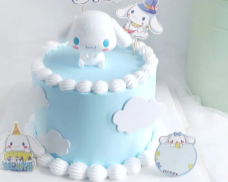 Light blue Cinnamoroll themed cake with white icing borders, fondant clouds, and character toppers. Light blue Cinnamoroll themed cake with white icing borders, fondant clouds, and character toppers.