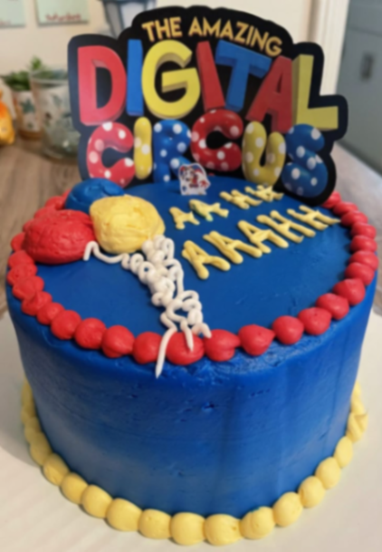 Blue Amazing Digital Circus themed cake with red and yellow icing borders and character printout topper. Blue Amazing Digital Circus themed cake with red and yellow icing borders and character printout topper.