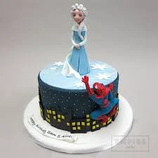 Frozen Spiderman-Inspired Sky Blue Cake Navy blue and light blue 1-tier fondant cake with an Elsa topper, Spiderman accent, and city silhouette