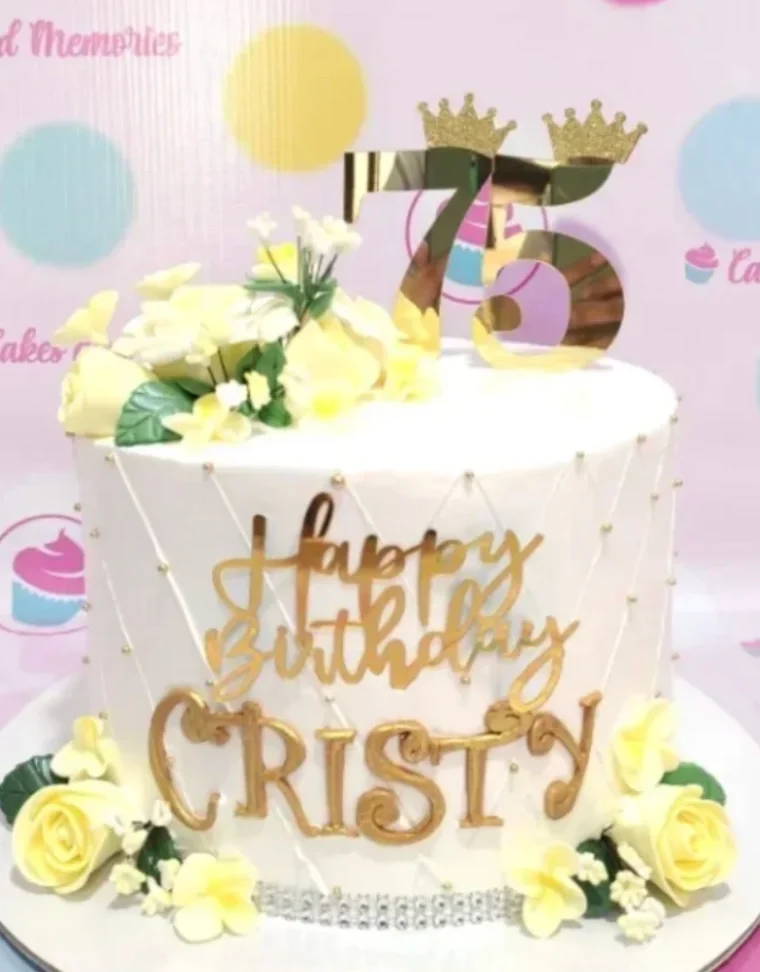 Gold Luxury Birthday White Floral Cake White 1-tier cake with soft icing, piped quilted lines, yellow fondant roses, and a gold number 75 topper