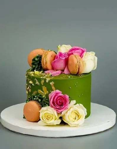 Green Floral Macaron Cake Green 1-tier cake with soft icing finish, Green Floral Macaron theme, and intricate pink fondant roses