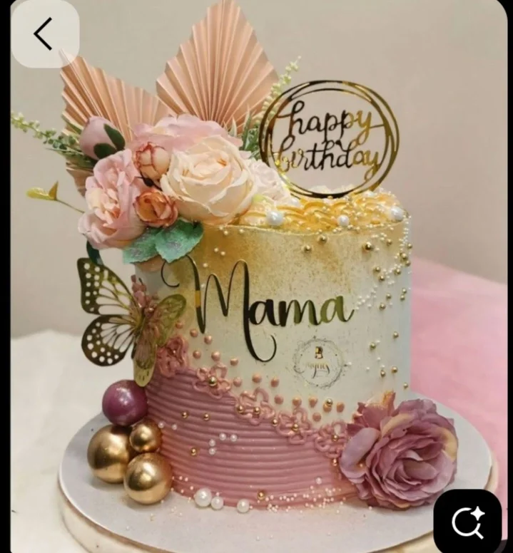 Elegant pink and white tall cake for Mama with gold accents, fresh roses, and a butterfly. Elegant pink and white tall cake for Mama with gold accents, fresh roses, and a butterfly.