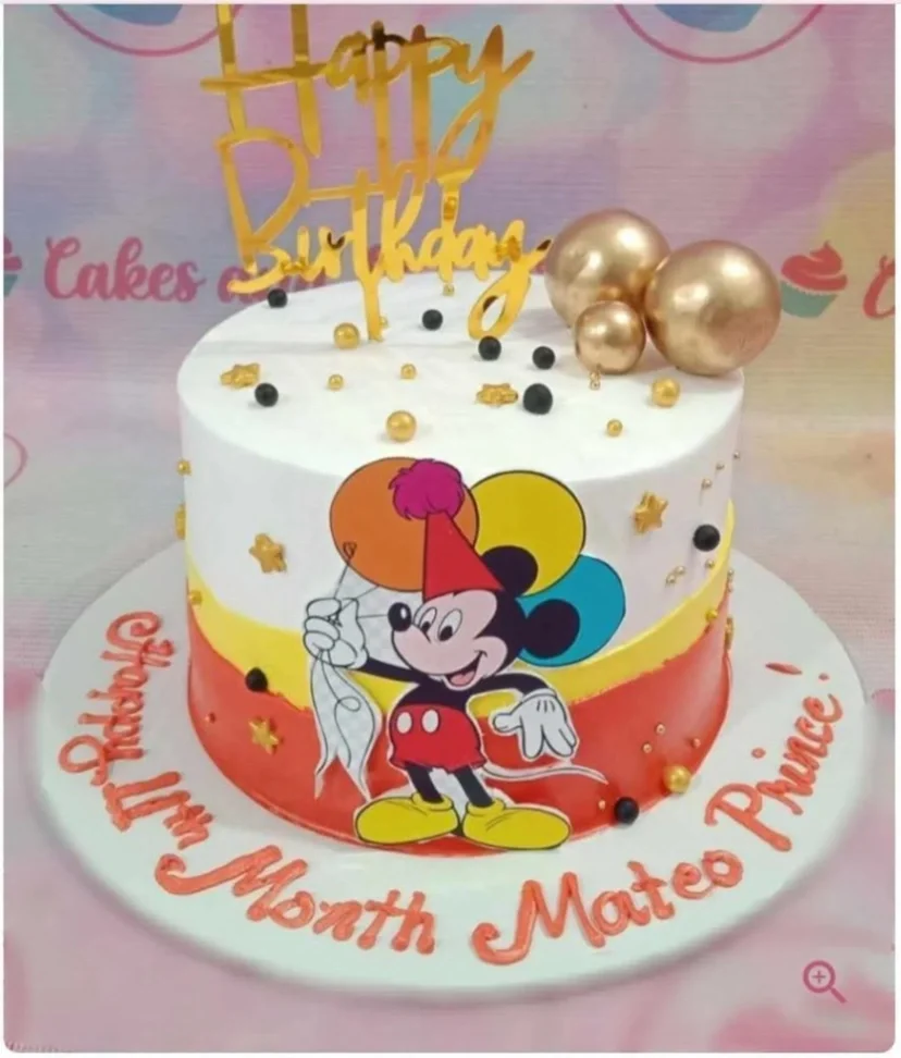 Mickey Mouse-Inspired Cake White and red 1 tier cake with soft icing, Mickey Mouse printout, and a gold acrylic Happy Birthday topper