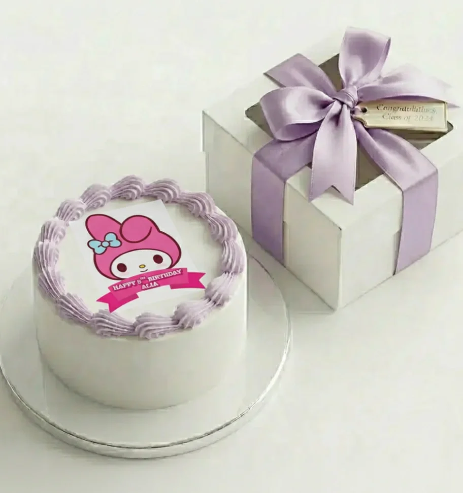 White 1-tier My Melody birthday cake with lavender icing borders and a pink character printout for Alia's 8th birthday. White 1-tier My Melody birthday cake with lavender icing borders and a pink character printout for Alia's 8th birthday.