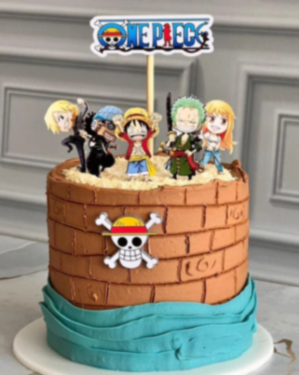 One Piece themed birthday cake with brown brick-textured icing, blue wave base, and character printout toppers including Luffy and Zoro. One Piece themed birthday cake with brown brick-textured icing, blue wave base, and character printout toppers including Luffy and Zoro.