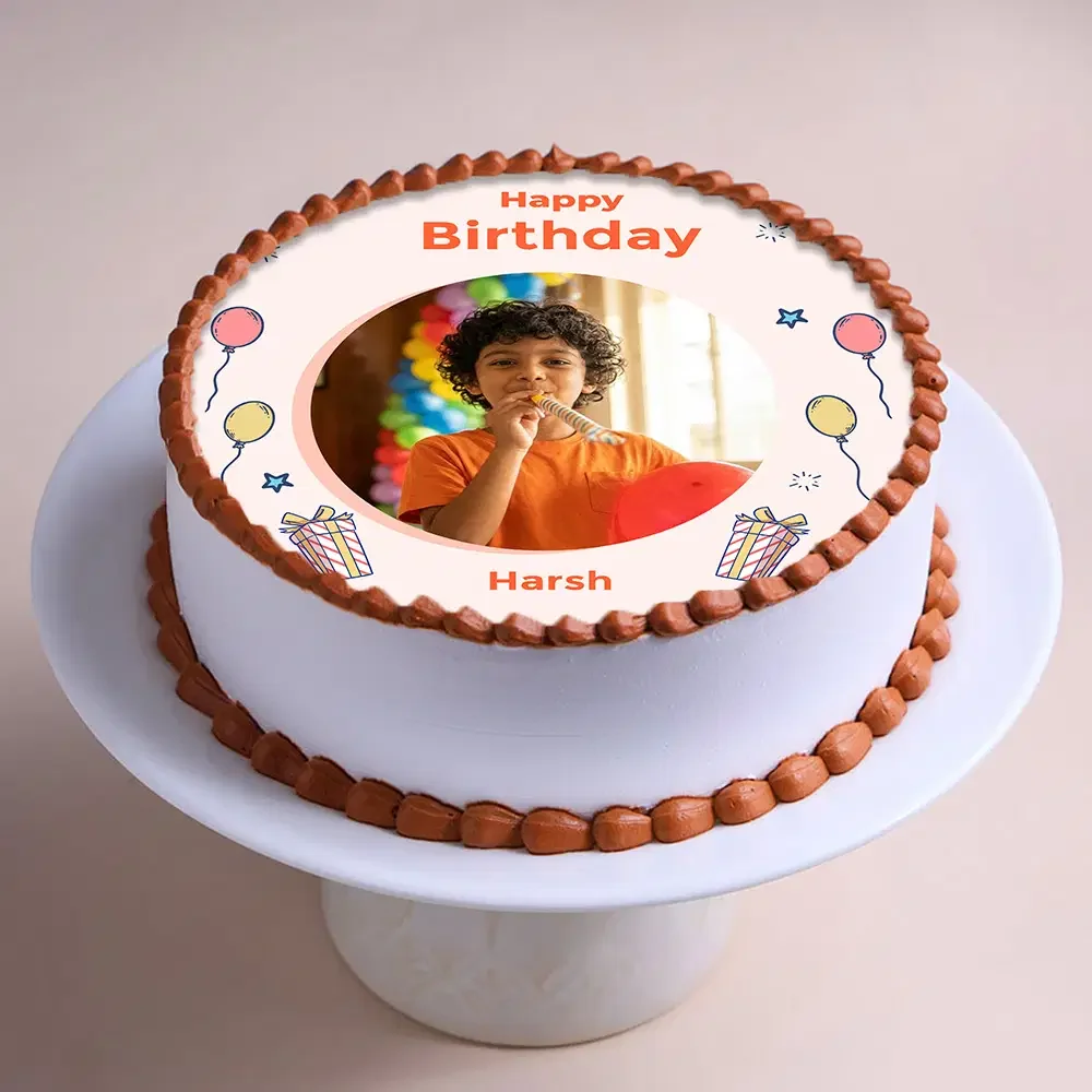 White 1-tier birthday cake with edible photo print of a boy and brown piped borders