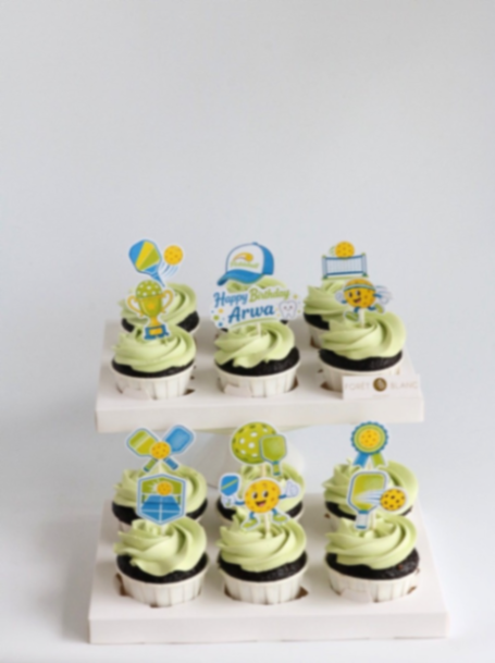 Pickleball Mint Birthday Cupcakes Light green icing cupcakes with pickleball theme printout toppers and birthday message
