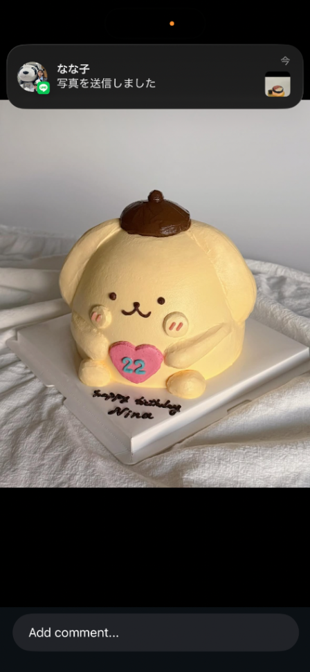 Pompompurin character cake with a yellow icing base, brown hat, and a pink heart with the number 22. Pompompurin character cake with a yellow icing base, brown hat, and a pink heart with the number 22.