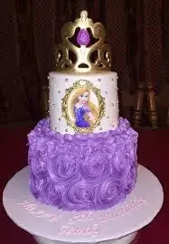 Rapunzel-Inspired Princess 2-Tier Birthday Cake Purple and white 2 tier fondant birthday cake with a gold crown, Rapunzel portrait panel, and piped board message