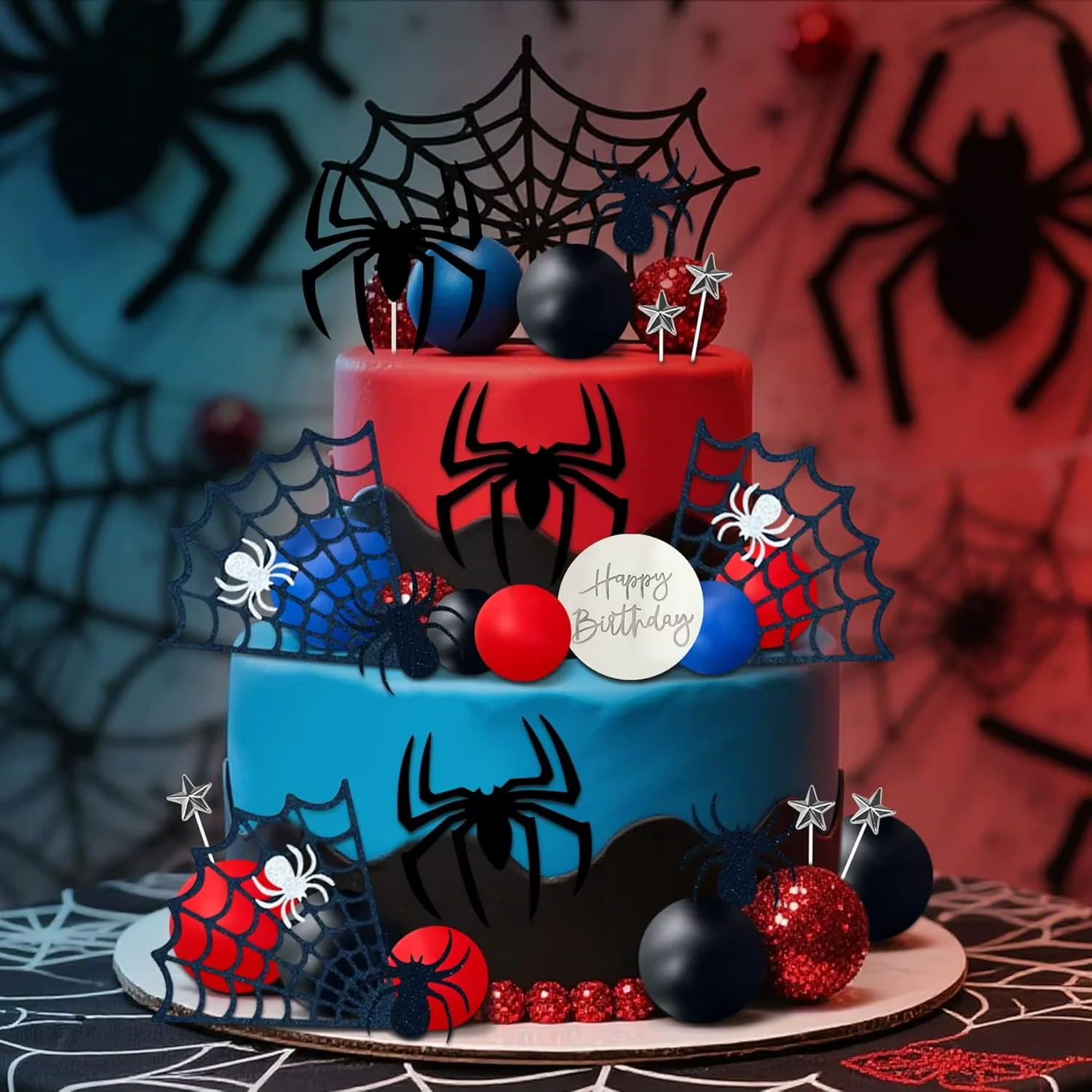 Spider Superhero 2-Tier Birthday Cake Blue and red 2-tier birthday cake with black spider web toppers, toy spheres, and spider accents