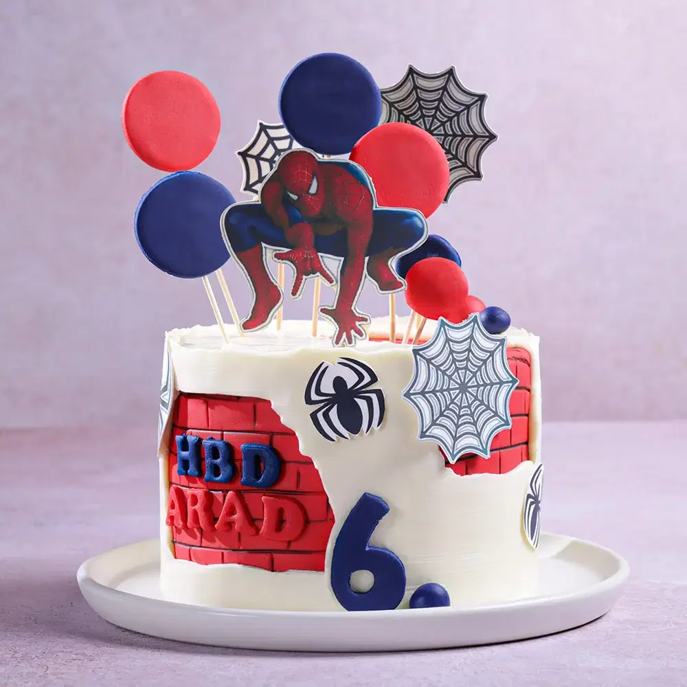 Spiderman-Inspired Birthday White Cake White 1-tier soft icing birthday cake with a Spiderman cutout, red brick panel, and blue age topper