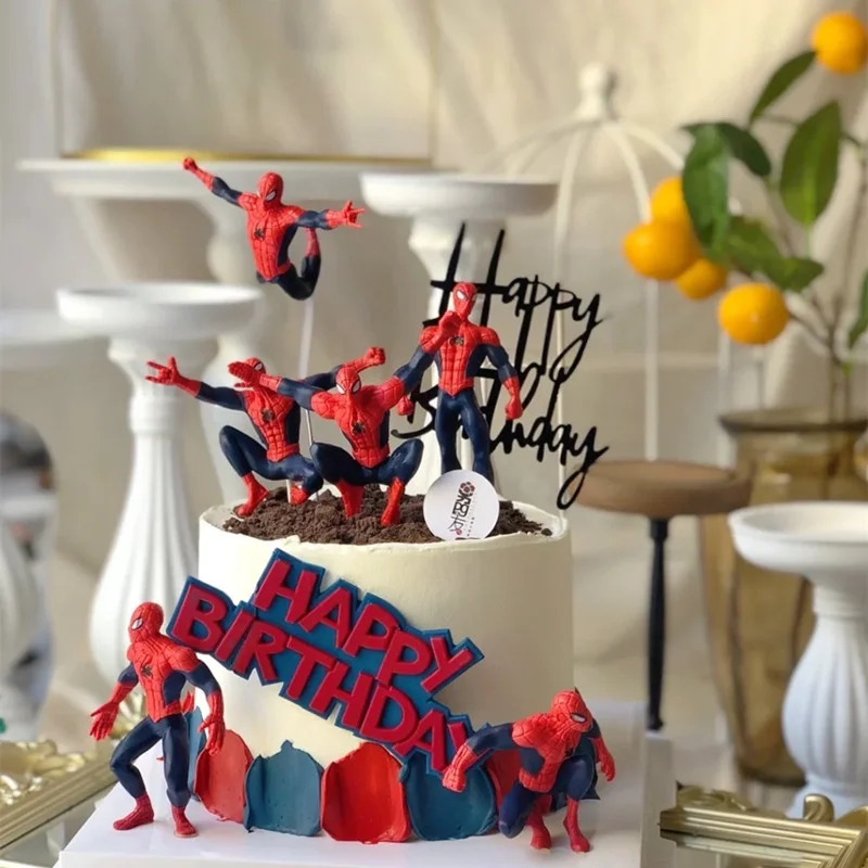 Spiderman-Inspired Birthday White Cake White 1-tier soft icing birthday cake with Spiderman action figures, black cardstock topper, and red and blue side panels