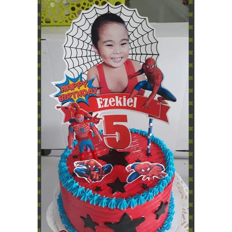 Spiderman-Inspired Memory Birthday Cake Red 1-tier soft icing birthday cake with blue piped borders, Spiderman printouts, and a custom photo topper