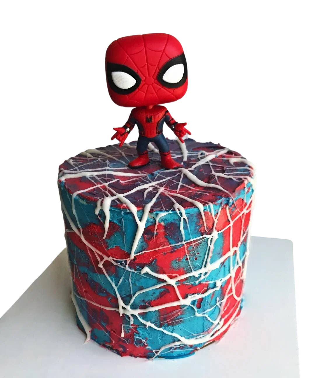 Spiderman-Inspired Birthday Cake Red and blue 1-tier soft icing birthday cake with a Spider-Man Funko Pop toy topper and white piped spider web icing