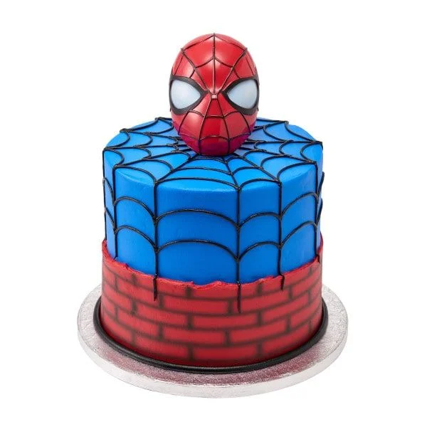 Spiderman-Inspired Birthday Cake Blue and red 1-tier cake with soft icing, a Spiderman mask topper, brick side panel, and black piped spider web lines