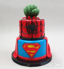 Superhero 2-Tier Cake Red and yellow 2-tier fondant superhero cake with a Hulk fist topper and Batman logo panels