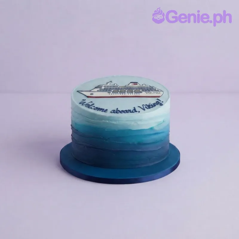 Light blue and navy blue gradient 1-tier cake with a cruise ship topper and piped message Light blue and navy blue gradient 1-tier cake with a cruise ship topper and piped message