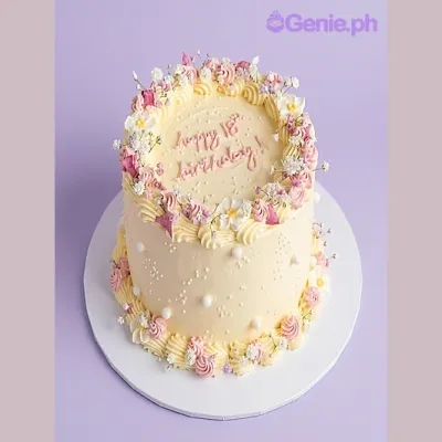 Light yellow 1-tier birthday cake with pink and white piped rosettes and small white flowers Light yellow 1-tier birthday cake with pink and white piped rosettes and small white flowers