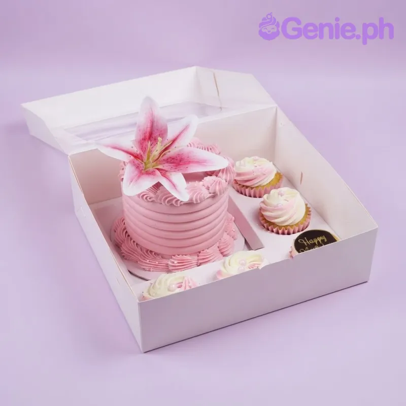Pink bento with a large lily flower and five matching cupcakes in a box Pink bento with a large lily flower and five matching cupcakes in a box