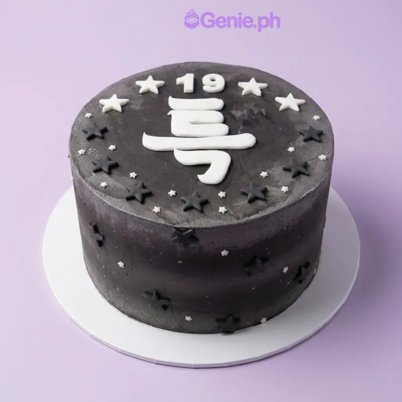 Black 1-tier birthday cake with white fondant number 19 and star decorations Black 1-tier birthday cake with white fondant number 19 and star decorations