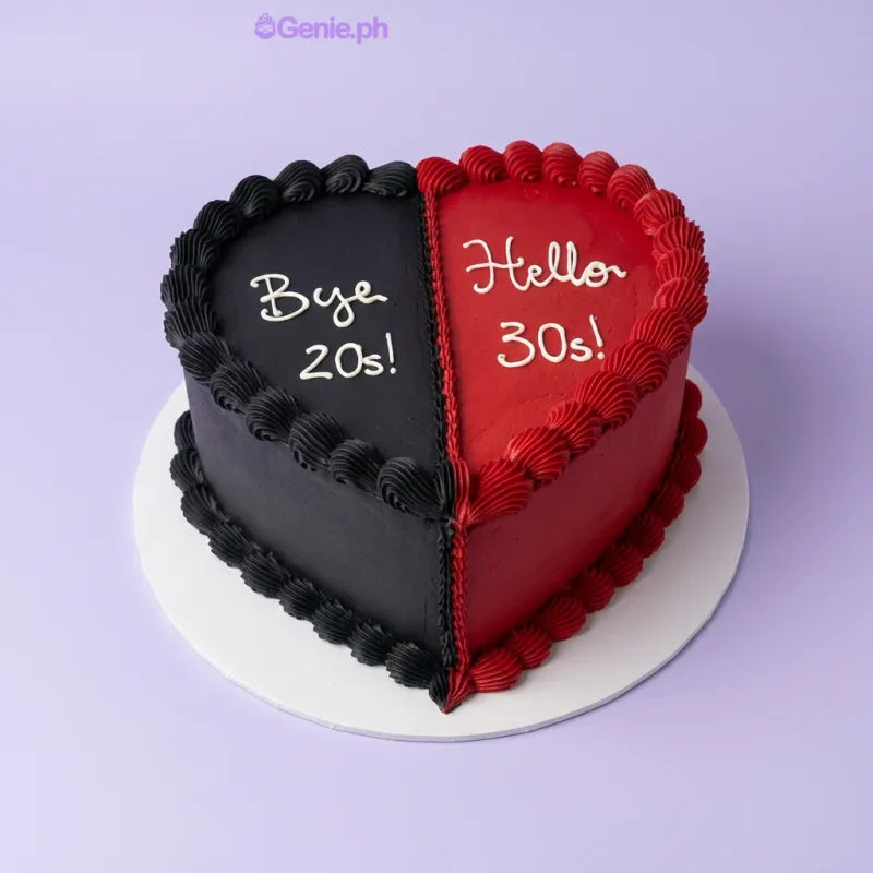 Heart-shaped 30th birthday cake split into black and red halves with piped borders and white icing text Heart-shaped 30th birthday cake split into black and red halves with piped borders and white icing text
