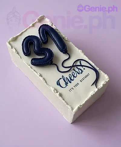 A white rectangular cake themed 31st Birthday, featuring navy blue 3D numbers 31 and 'Cheers!' message. A white rectangular cake themed 31st Birthday, featuring navy blue 3D numbers 31 and 'Cheers!' message.