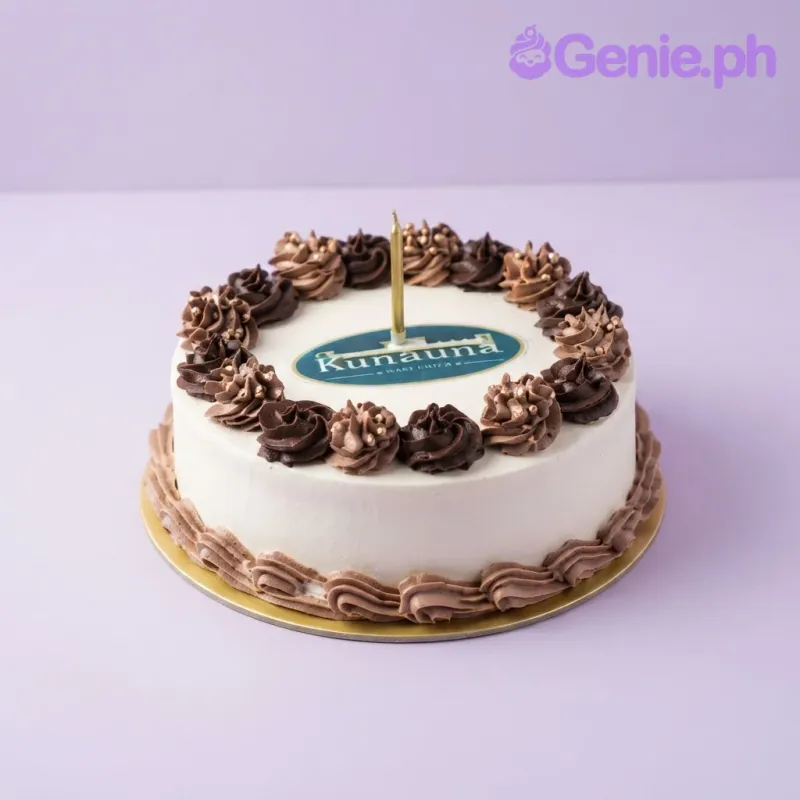 White 1-tier cake with soft icing, a printed corporate logo on top, chocolate piped rosettes, and a single candle White 1-tier cake with soft icing, a printed corporate logo on top, chocolate piped rosettes, and a single candle