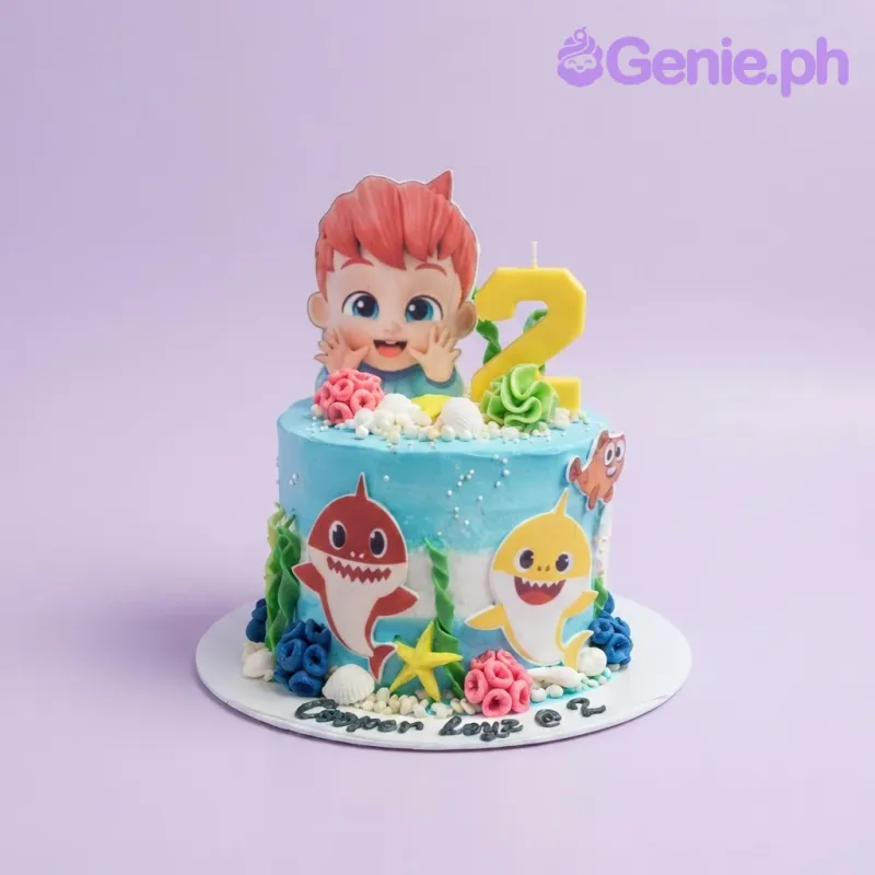 Sky blue 1-tier soft icing birthday cake with character printouts, sharks, and sea life decorations Sky blue 1-tier soft icing birthday cake with character printouts, sharks, and sea life decorations