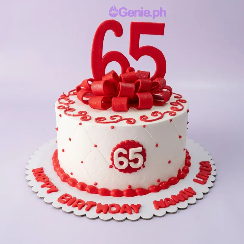 A white 1-tier 65th birthday cake with red icing swirls, a large red fondant bow, and red number 65 toppers. A white 1-tier 65th birthday cake with red icing swirls, a large red fondant bow, and red number 65 toppers.