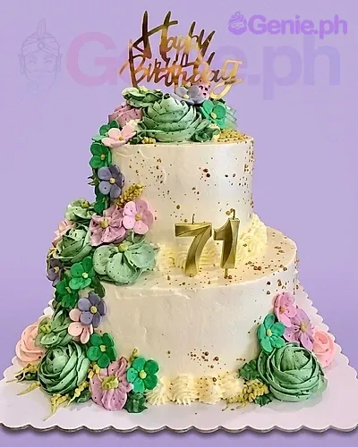 A colorful two-tier 71st Birthday cake, featuring gold 71 candles and gumpaste flowers. A colorful two-tier 71st Birthday cake, featuring gold 71 candles and gumpaste flowers.