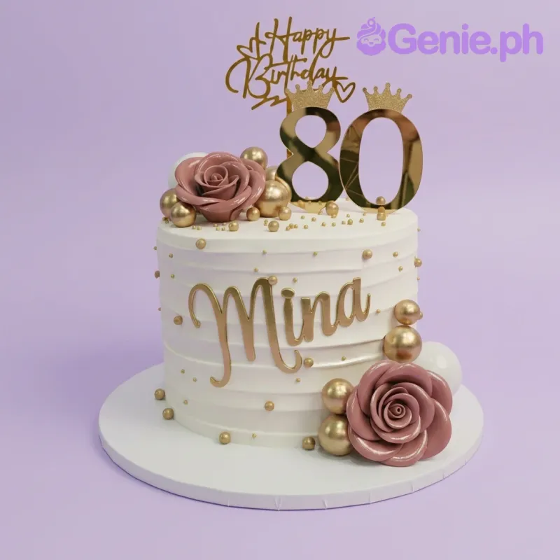 A white 1 Tier 80th Birthday cake, featuring gold '80' and 'HB' toppers, pink roses, and gold spheres. A white 1 Tier 80th Birthday cake, featuring gold '80' and 'HB' toppers, pink roses, and gold spheres.
