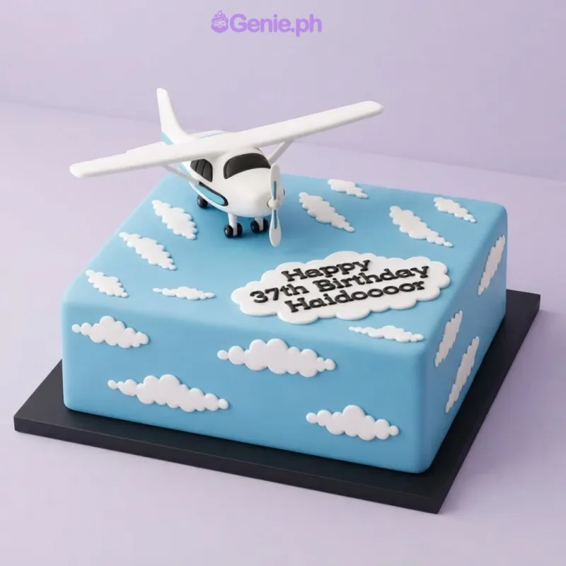 Light blue square fondant cake with a toy airplane topper and white fondant clouds for a 37th birthday Light blue square fondant cake with a toy airplane topper and white fondant clouds for a 37th birthday