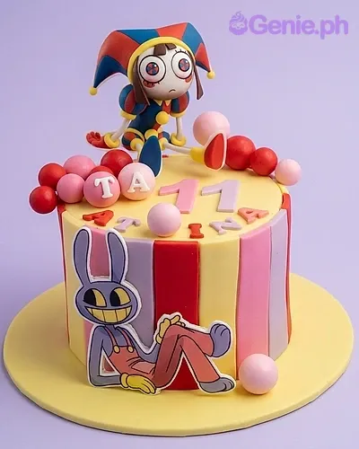 A colorful 1 Tier Fondant cake themed around Amazing Digital Circus, featuring a Pomni fondant figure, a Jax printout, and striped fondant panels. A colorful 1 Tier Fondant cake themed around Amazing Digital Circus, featuring a Pomni fondant figure, a Jax printout, and striped fondant panels.