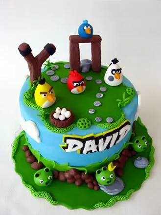Sky blue 1-tier cake with soft icing, Angry Birds theme, and fondant bird character and stone structure toppers Sky blue 1-tier cake with soft icing, Angry Birds theme, and fondant bird character and stone structure toppers