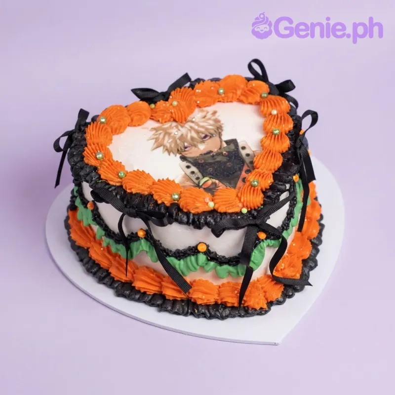 White heart cake with an anime character photo top, orange piped rosettes, green side ruffles, and black ribbon bows White heart cake with an anime character photo top, orange piped rosettes, green side ruffles, and black ribbon bows
